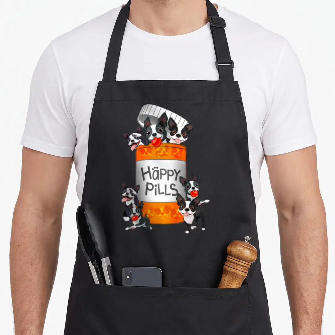 Boston tablet apron - Orange pill bottle with six Boston Terriers holding red pills and text Häppy PiLLS — shown on a black cotton canvas apron against a white background