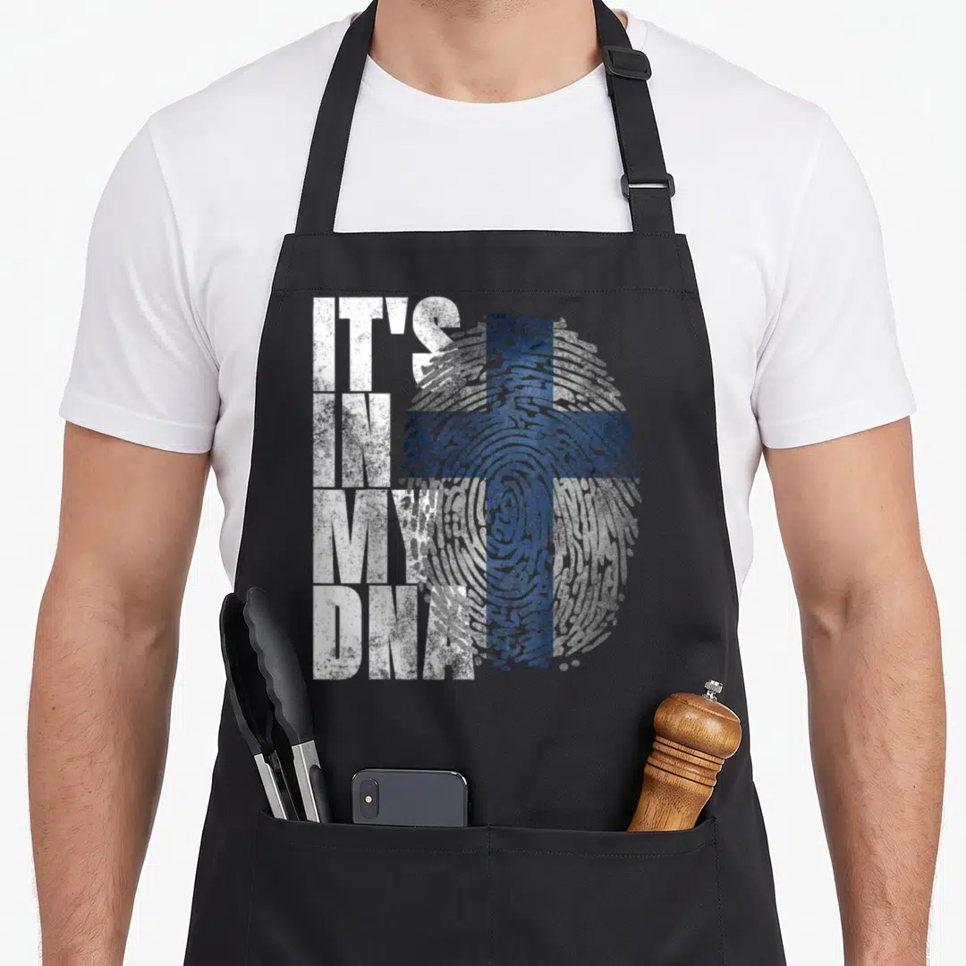 Dna finnish girl apron - Distressed IT'S IN MY DNA text beside a blue Finnish flag fingerprint — shown on a black cotton canvas apron against a white background