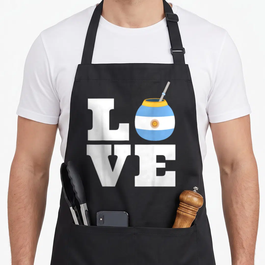Yerba pride apron - LOVE text with striped mate gourd replacing the O letter — shown on a black cotton canvas apron against a white background