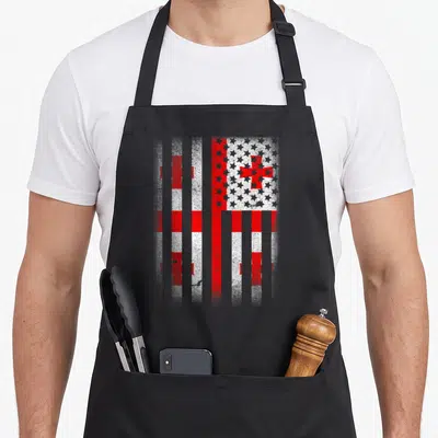 Georgian georgia american flag apron - Distressed red and white composite flag with US stars and Georgian crosses — shown on a black cotton canvas apron against a white background