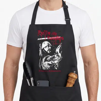 Jack crazy sparrow man apron - Distressed white man portrait with red Hello My Lovelies text and blood drips — shown on a black cotton canvas apron against a white background