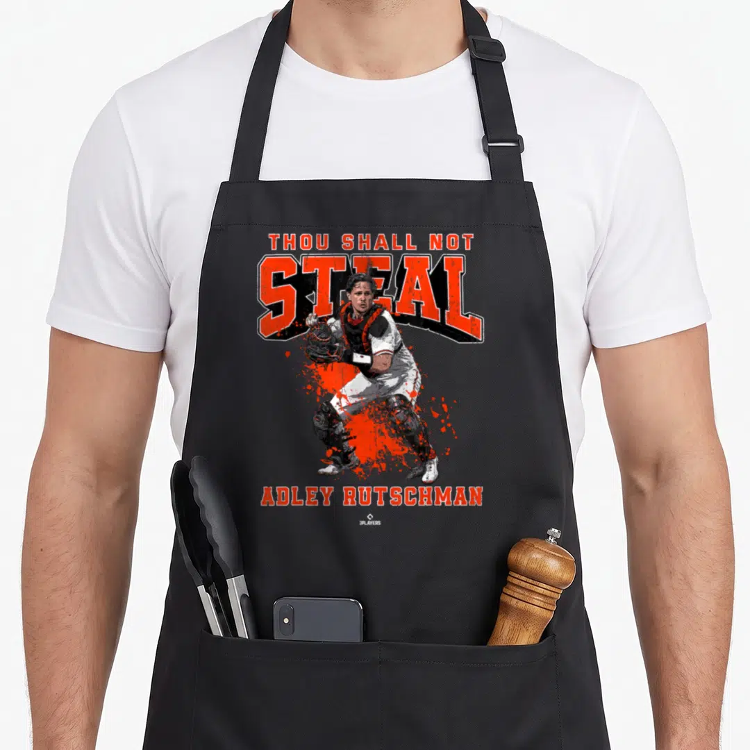 Thou ballpark mvp apron - Realistic catcher behind Thou Shall Not Steal text with orange splatter and Adley Rutschman — shown on a black cotton canvas apron against a white background