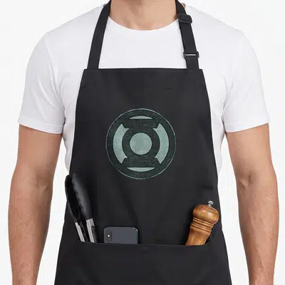 Hand novelty apron - Distressed green circular lantern emblem centered on grey background — shown on a black cotton canvas apron against a white background