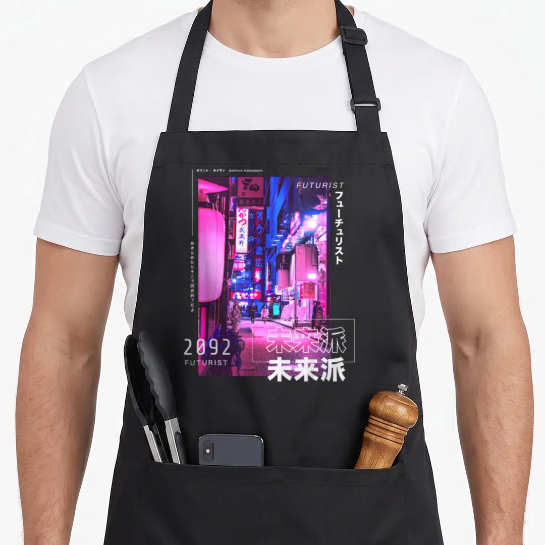 Japanese tokyo streetwear apron - Neon city street photo with FUTURIST text, 2092, and Japanese characters in pink — shown on a black cotton canvas apron against a white background