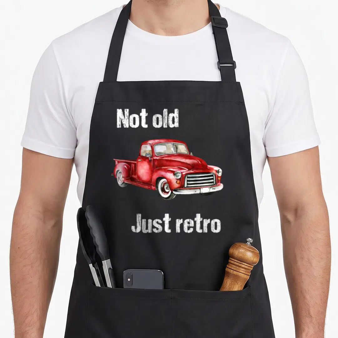 Pick truck apron - Red watercolor pickup truck with white text Not old Just retro on black apron — shown on a black cotton canvas apron against a white background