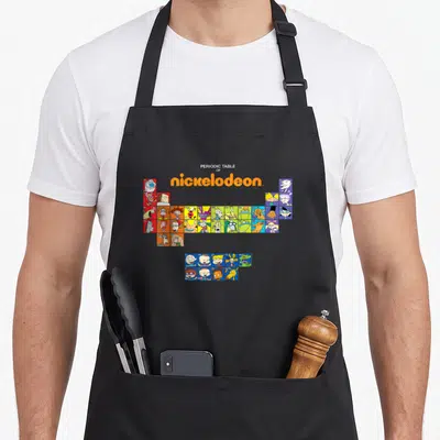Periodic table apron for women - Cartoon character grid layout with orange title text PERIODIC TABLE OF nickelodeon — shown on a black cotton canvas apron against a white background