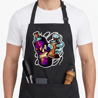 Graffiti fat man in apron - Purple spray can with face and blue hand holding brown can with white swirls — shown on a black cotton canvas apron against a white background