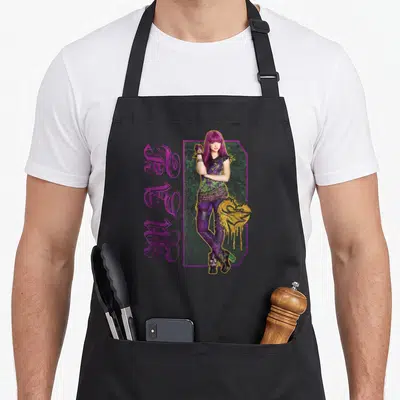 Descendant paint apron - Purple haired woman standing next to vertical MAGIC text with gold drip accents — shown on a black cotton canvas apron against a white background
