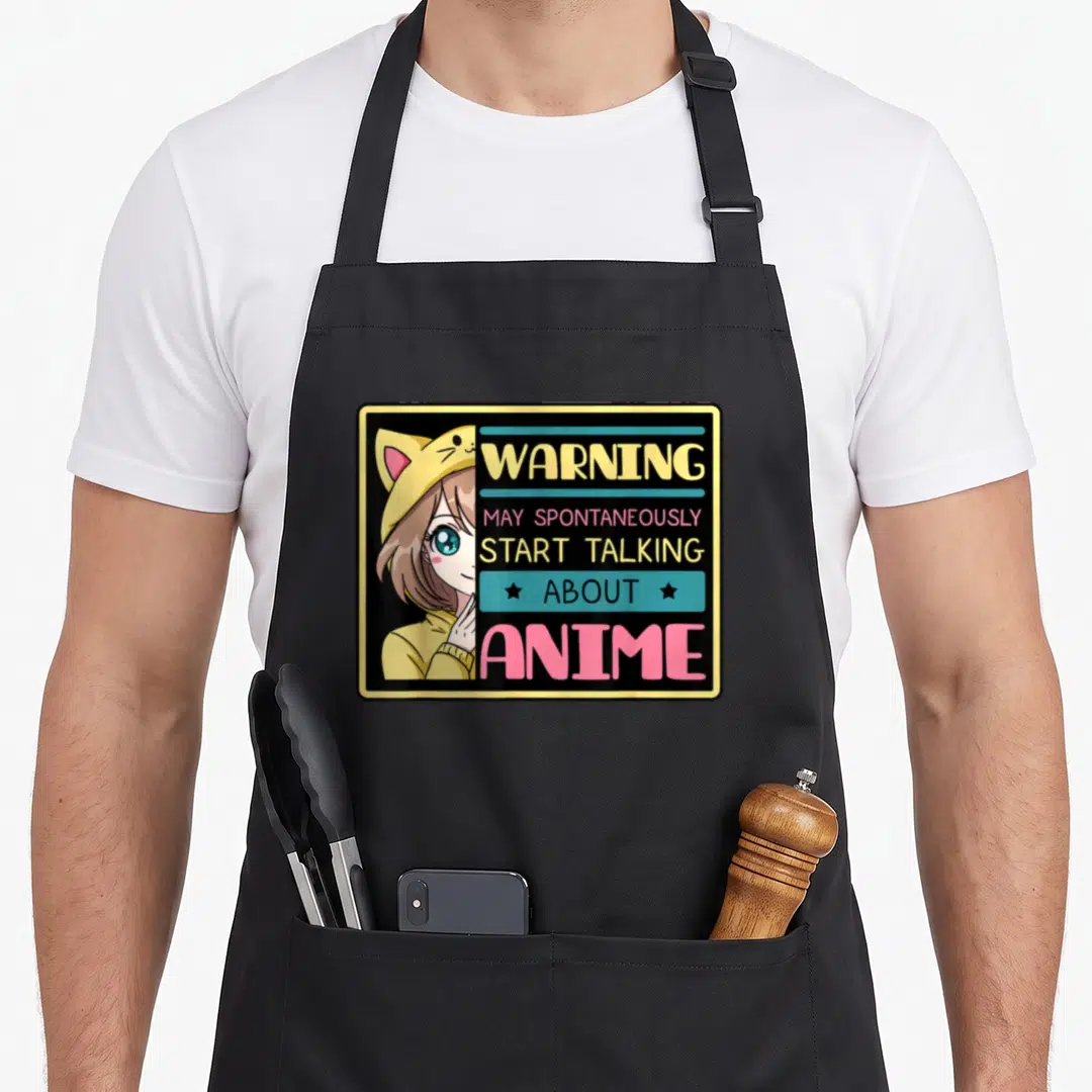May anime apron - Cartoon girl in yellow cat hat next to warning text about talking about anime — shown on a black cotton canvas apron against a white background