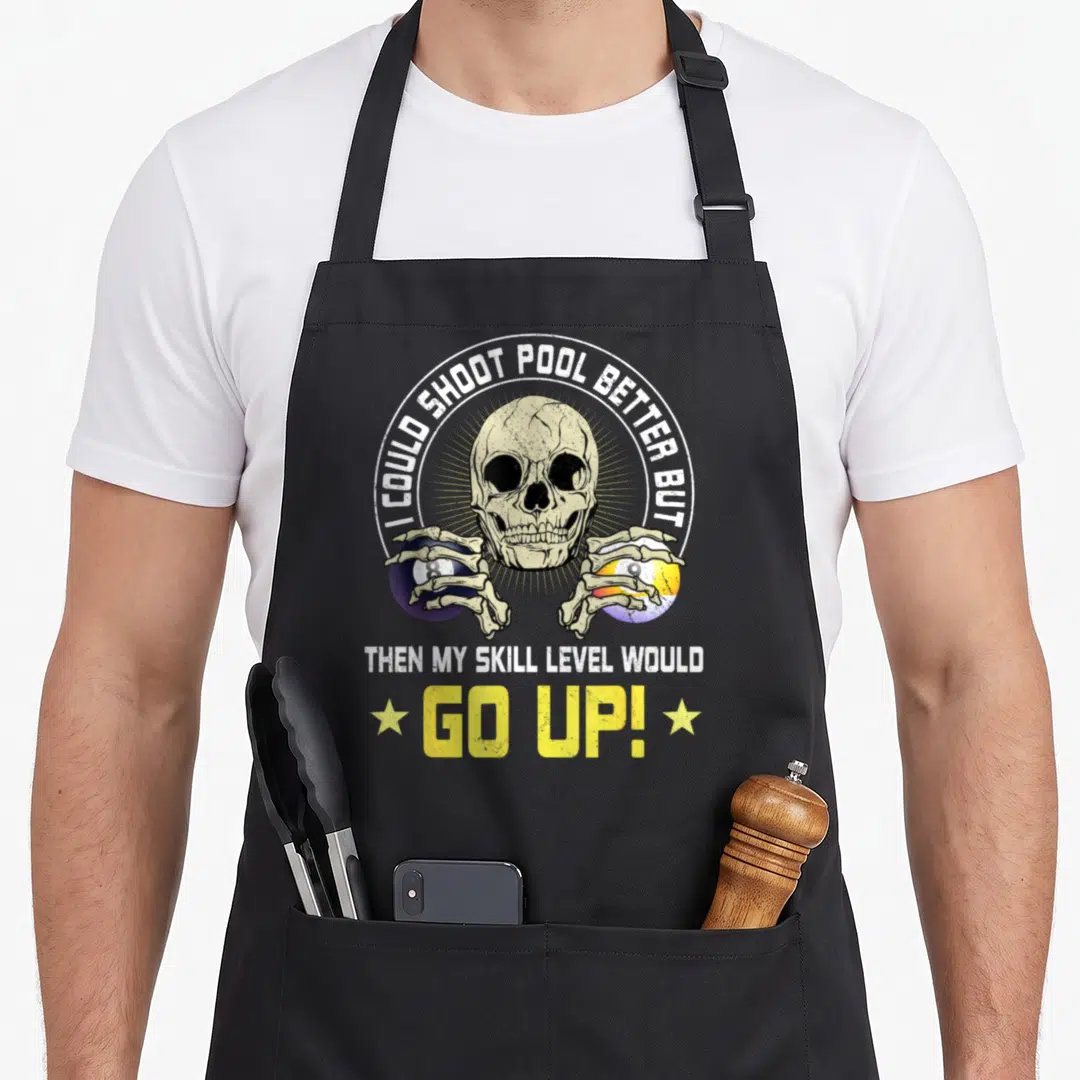 Skull pool table apron - Beige skull holding purple 8-ball and yellow striped ball with arched text and stars — shown on a black cotton canvas apron against a white background