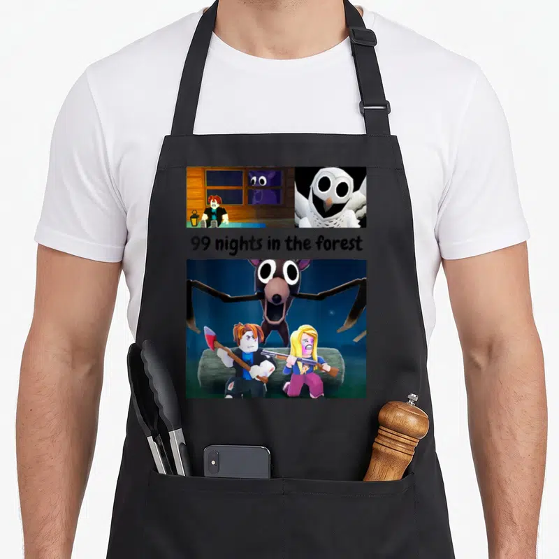 Night forest apron - Cartoon characters fighting a spider monster below 99 nights in the forest text — shown on a black cotton canvas apron against a white background