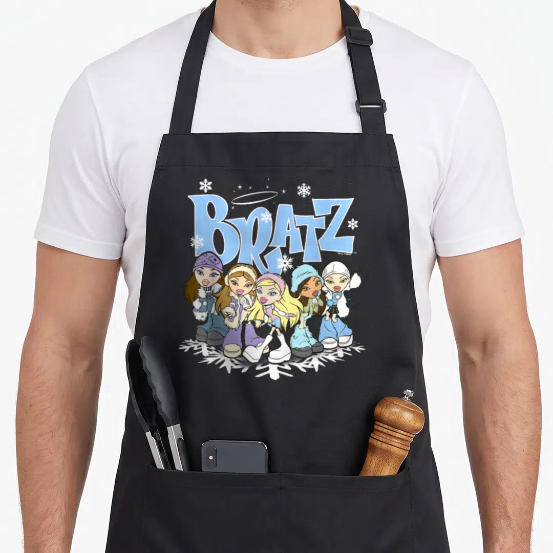 Bratz winter apron - Five cartoon dolls standing on a white snowflake under blue Bratz logo with halo — shown on a black cotton canvas apron against a white background