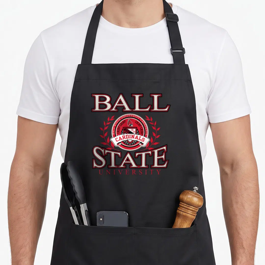 Ball state laurel cardinal apron - Red and white Ball State University logo with bird emblem and laurel leaves on black — shown on a black cotton canvas apron against a white background