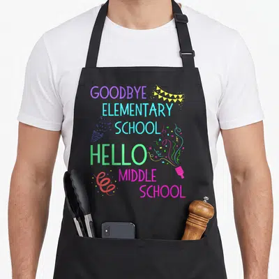 Middle hello apron - Stacked text Goodbye Elementary School Hello Middle School with party horn bunting and confetti — shown on a black cotton canvas apron against a white background