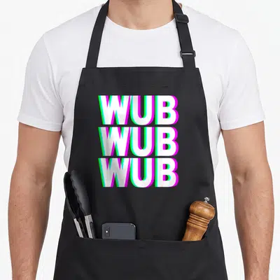 Wub techno apron - Stacked white WUB text with magenta and cyan glitch outlines on black fabric — shown on a black cotton canvas apron against a white background