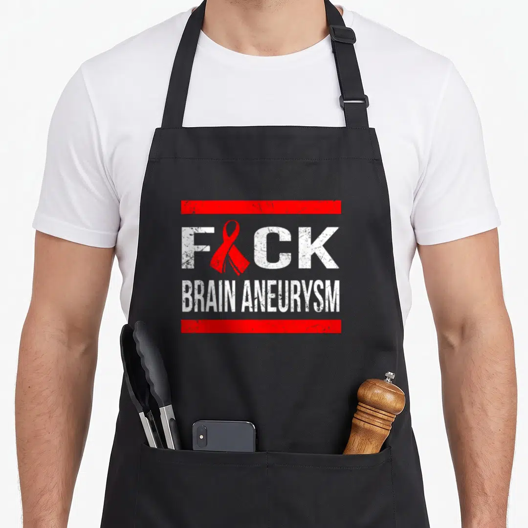 Support aneurysm awareness apron - Distressed white text F CK BRAIN ANEURYSM with red ribbon replacing U between two — shown on a black cotton canvas apron against a white background