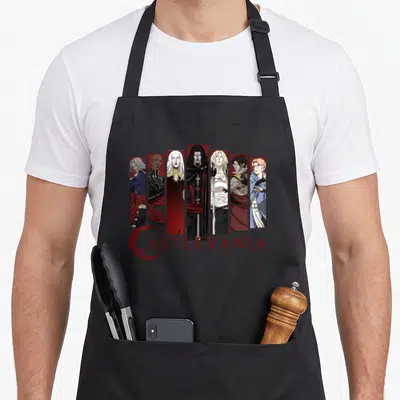 Castlevania character aprons - Six anime characters in vertical panels above red Castlevania text and crescent logo — shown on a black cotton canvas apron against a white background