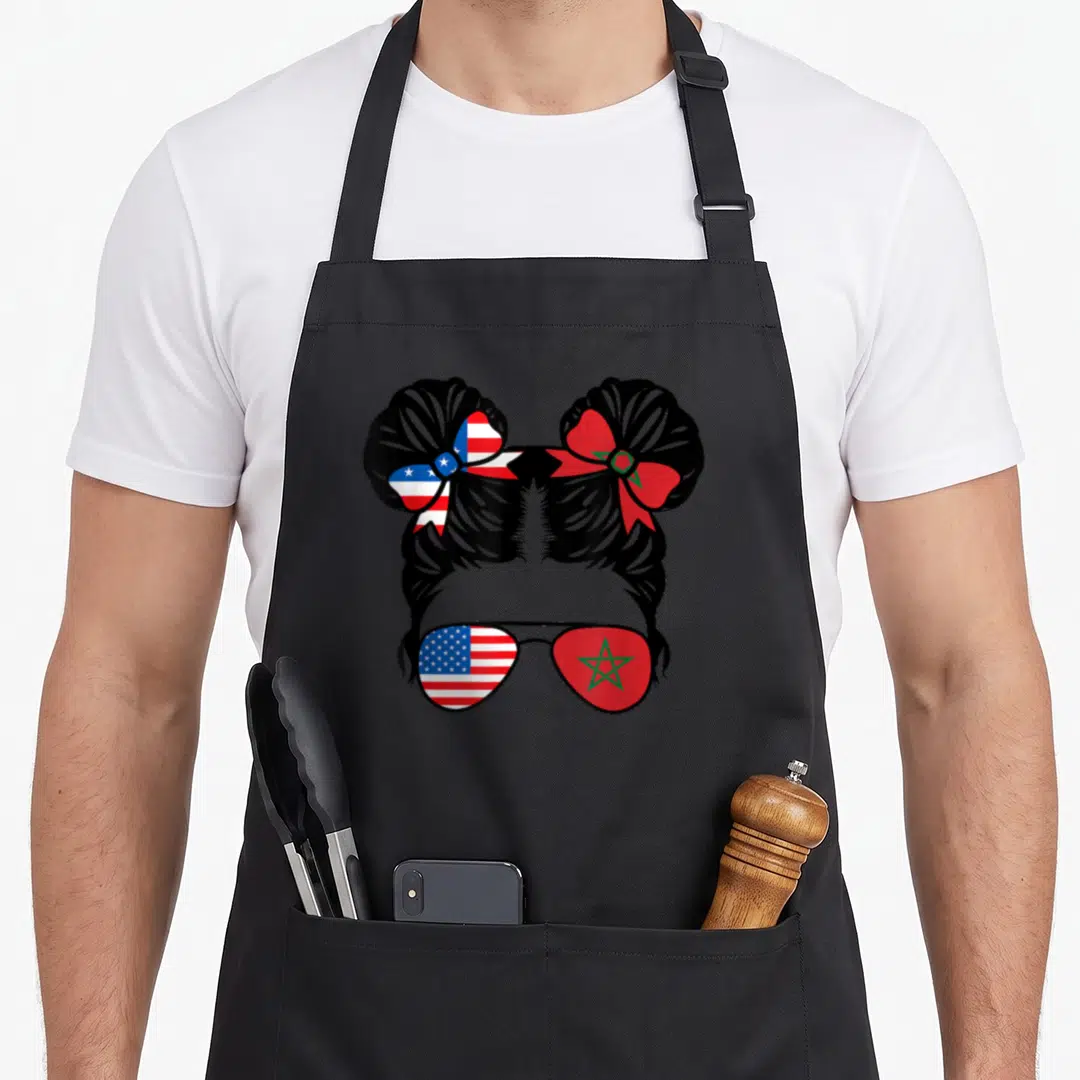 Morocco patriot american flag apron - Silhouette of girl with two buns and sunglasses; USA flag on left, Morocco flag — shown on a black cotton canvas apron against a white background