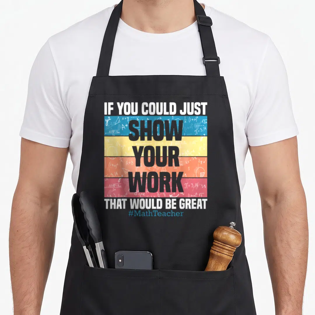 Geometry teacher apron - Stacked text over blue yellow orange red stripes with math formulas and symbols — shown on a black cotton canvas apron against a white background