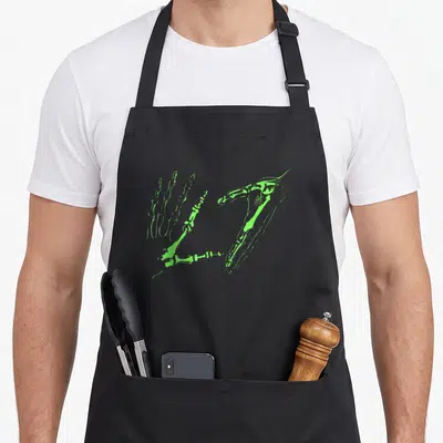 Funny hand skeleton apron - Two lime green skeletal hands in line art forming a heart shape on black fabric — shown on a black cotton canvas apron against a white background