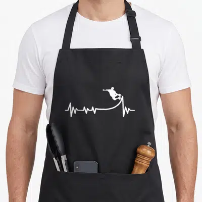 Skaterramp best skater skateboarder accessories stuff apron - White heartbeat line curving into a ramp launching — shown on a black cotton canvas apron against a white background