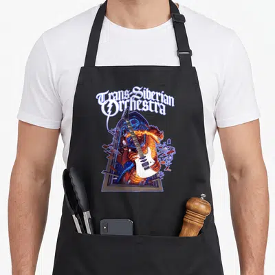 Tran dragon apron - Orange dragon holding white guitar bursting through gothic window with arched text above — shown on a black cotton canvas apron against a white background