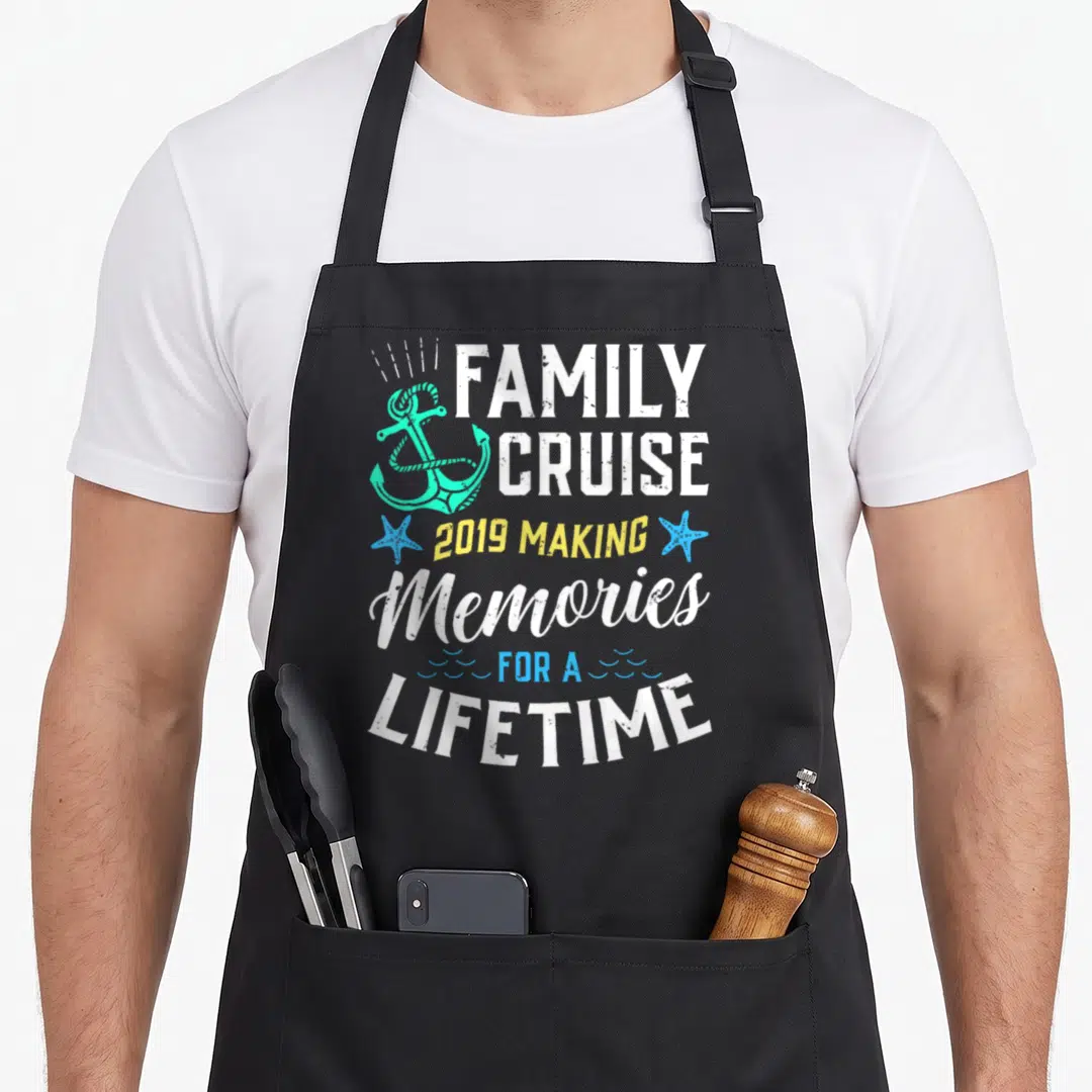 Lifetime memory apron - Distressed text FAMILY CRUISE 2019 with turquoise anchor and blue starfish — shown on a black cotton canvas apron against a white background