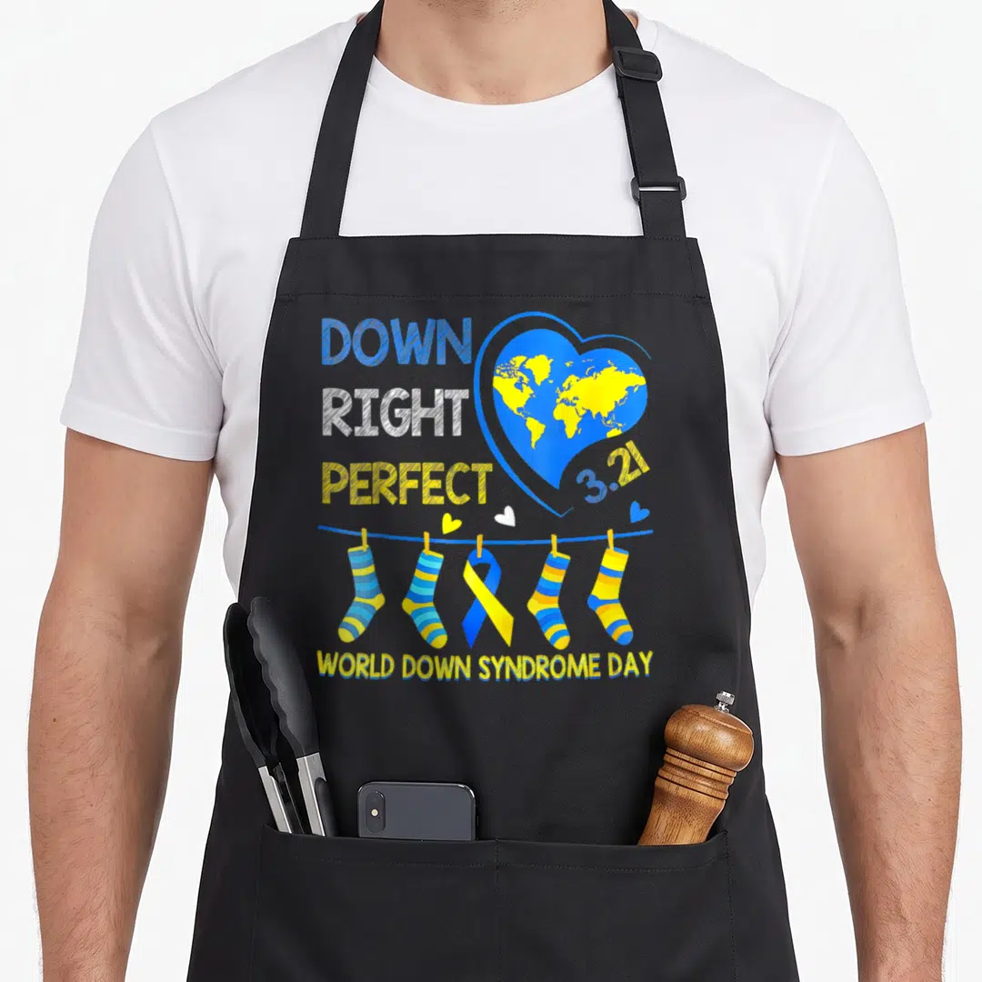Right down syndrome awareness apron - Blue heart with yellow world map, stacked text, and four striped socks — shown on a black cotton canvas apron against a white background