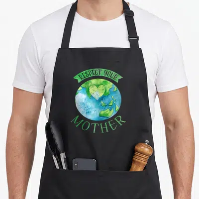 Respect mother change apron - Watercolor globe with heart shaped continents and text RESPECT YOUR MOTHER in blue — shown on a black cotton canvas apron against a white background