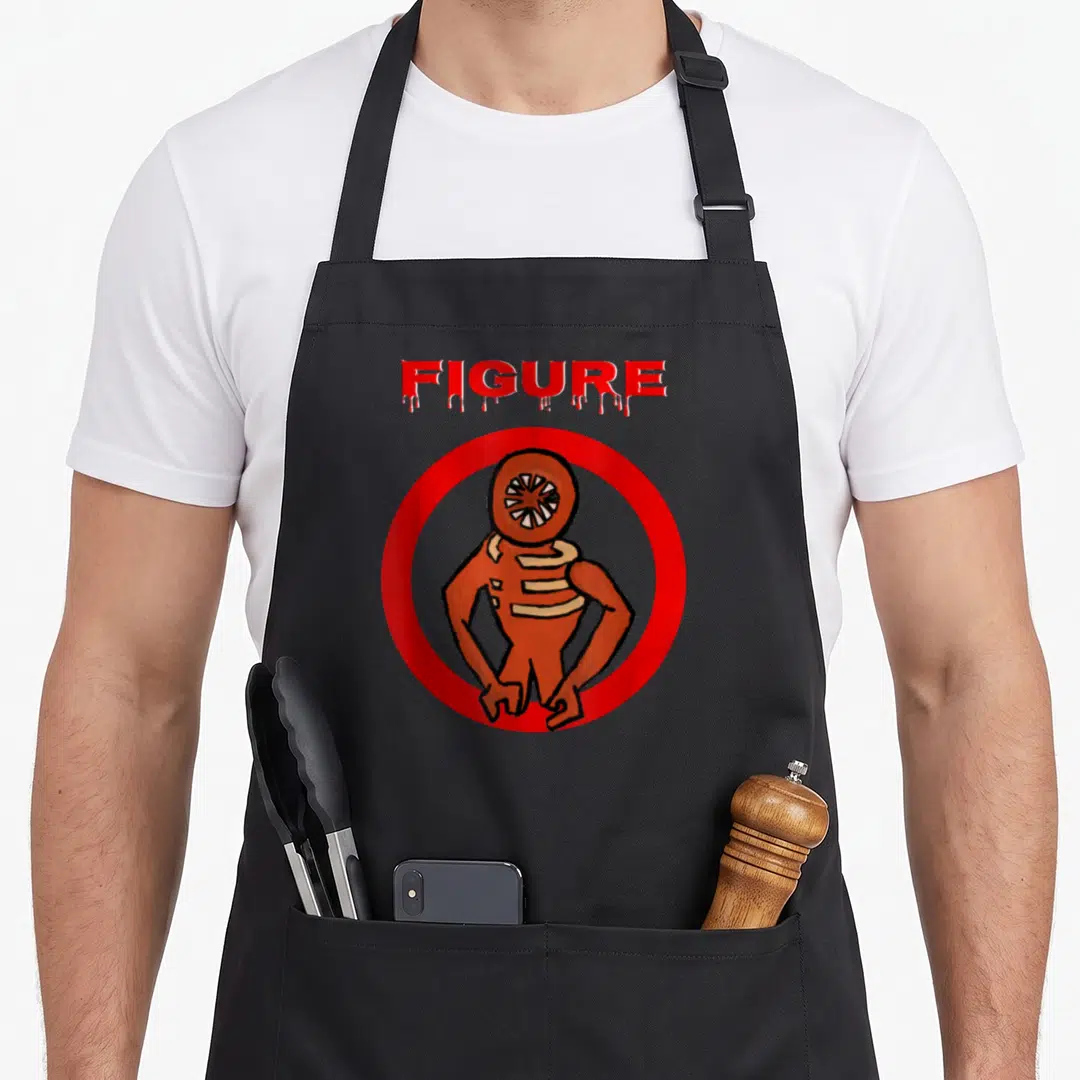 Monster door apron - FIGURE text dripping over orange monster in red circle cartoon style — shown on a black cotton canvas apron against a white background