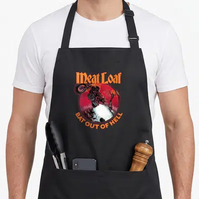Bat meat aprons - Meat Loaf Bat Out of Hell motorcyclist illustration in red circle — shown on a black cotton canvas apron against a white background