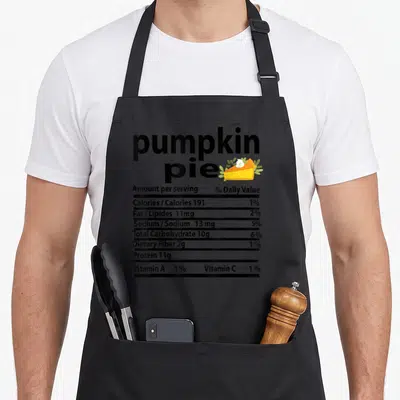 Pumpkin pie thanksgiving aprons - Nutrition label graphic with pumpkin pie text, orange slice, and listed calories — shown on a black cotton canvas apron against a white background