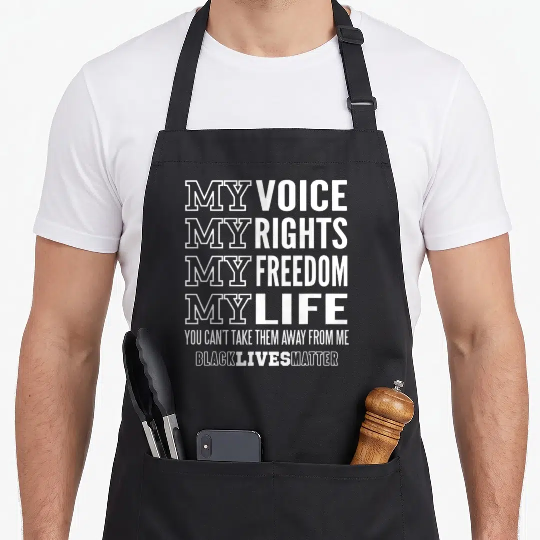 Voice freedom apron - White stacked typography reading My Voice My Rights My Freedom My Life Black Lives Matter — shown on a black cotton canvas apron against a white background