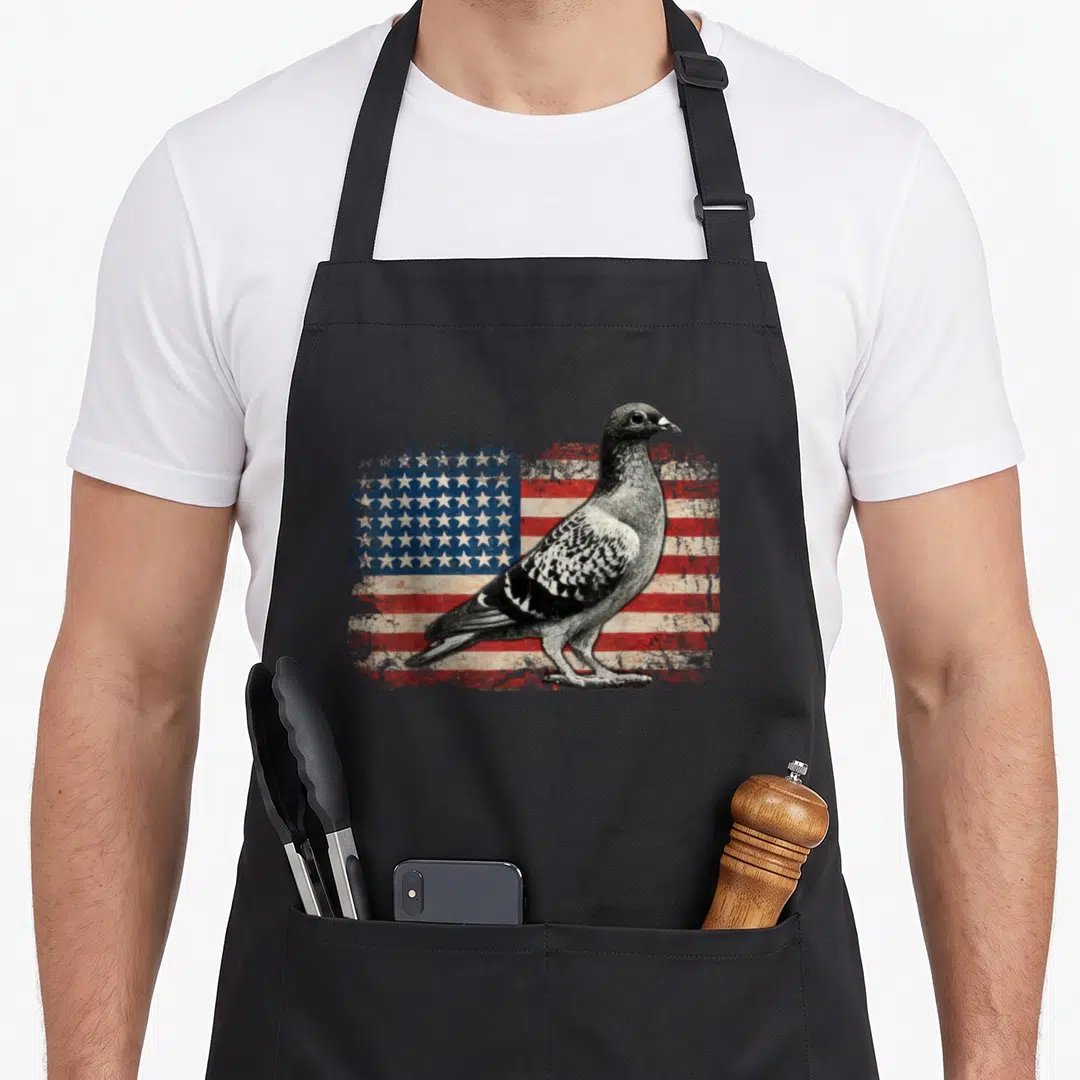 Pigeon 4th of july apron - Realistic grey pigeon standing in front of a distressed red white and blue American flag — shown on a black cotton canvas apron against a white background