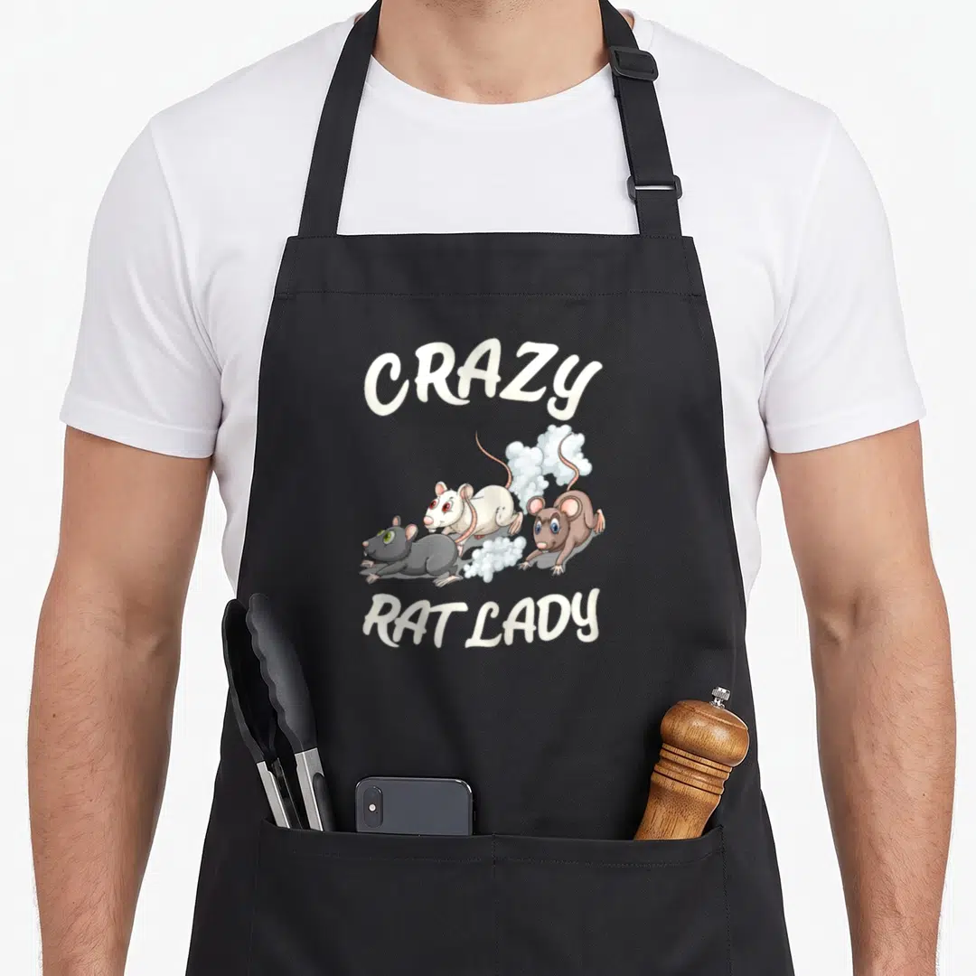 Rat pet rodent animal apron - Three running rats in grey, white, and brown beneath arched text reading CRAZY RAT LADY — shown on a black cotton canvas apron against a white background