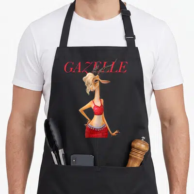 Gazelle novelty apron - Red GAZELLE text above a standing tan cartoon gazelle in a sparkly red outfit — shown on a black cotton canvas apron against a white background