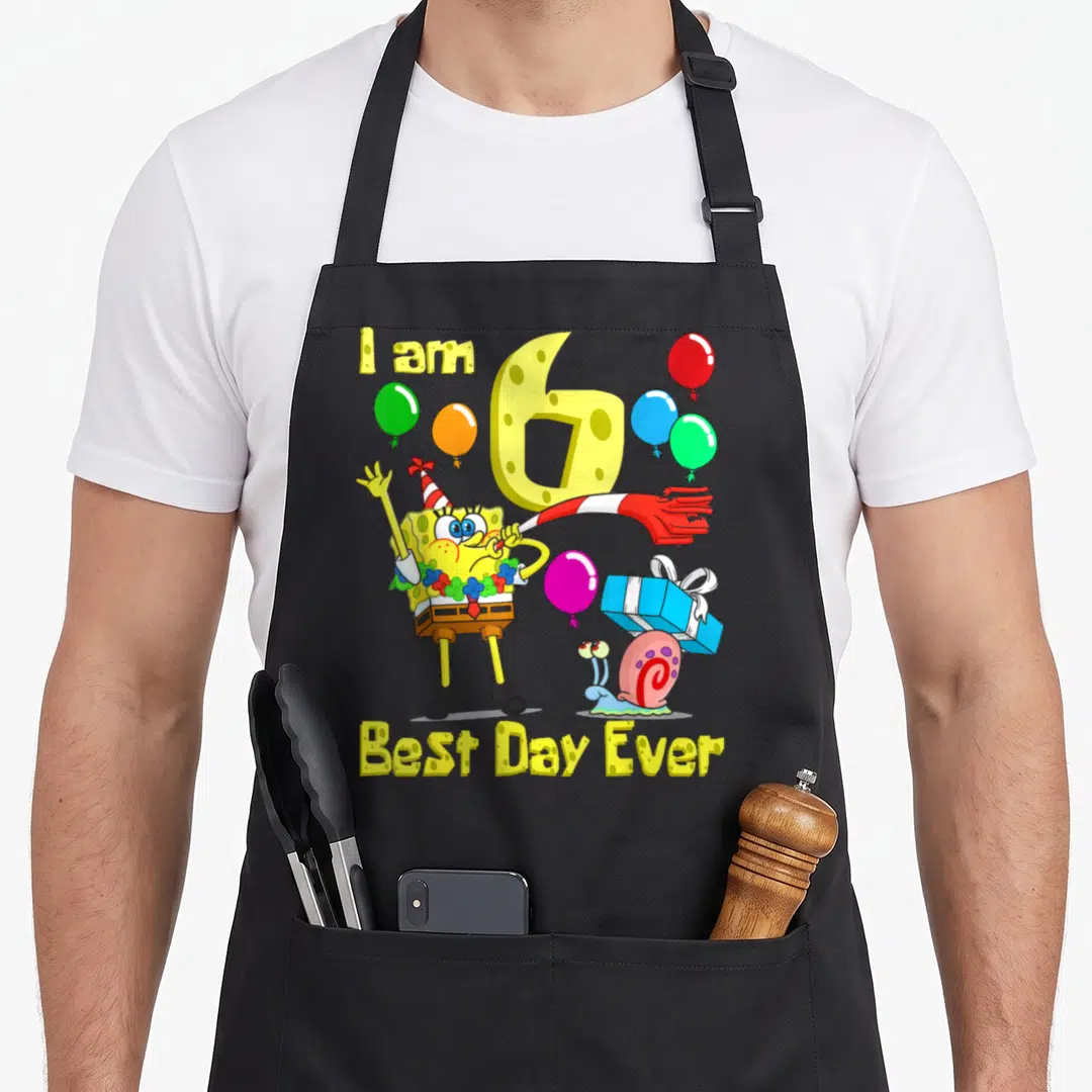 Age bday apron - SpongeBob SquarePants blowing horn with I am 6 text and balloons — shown on a black cotton canvas apron against a white background
