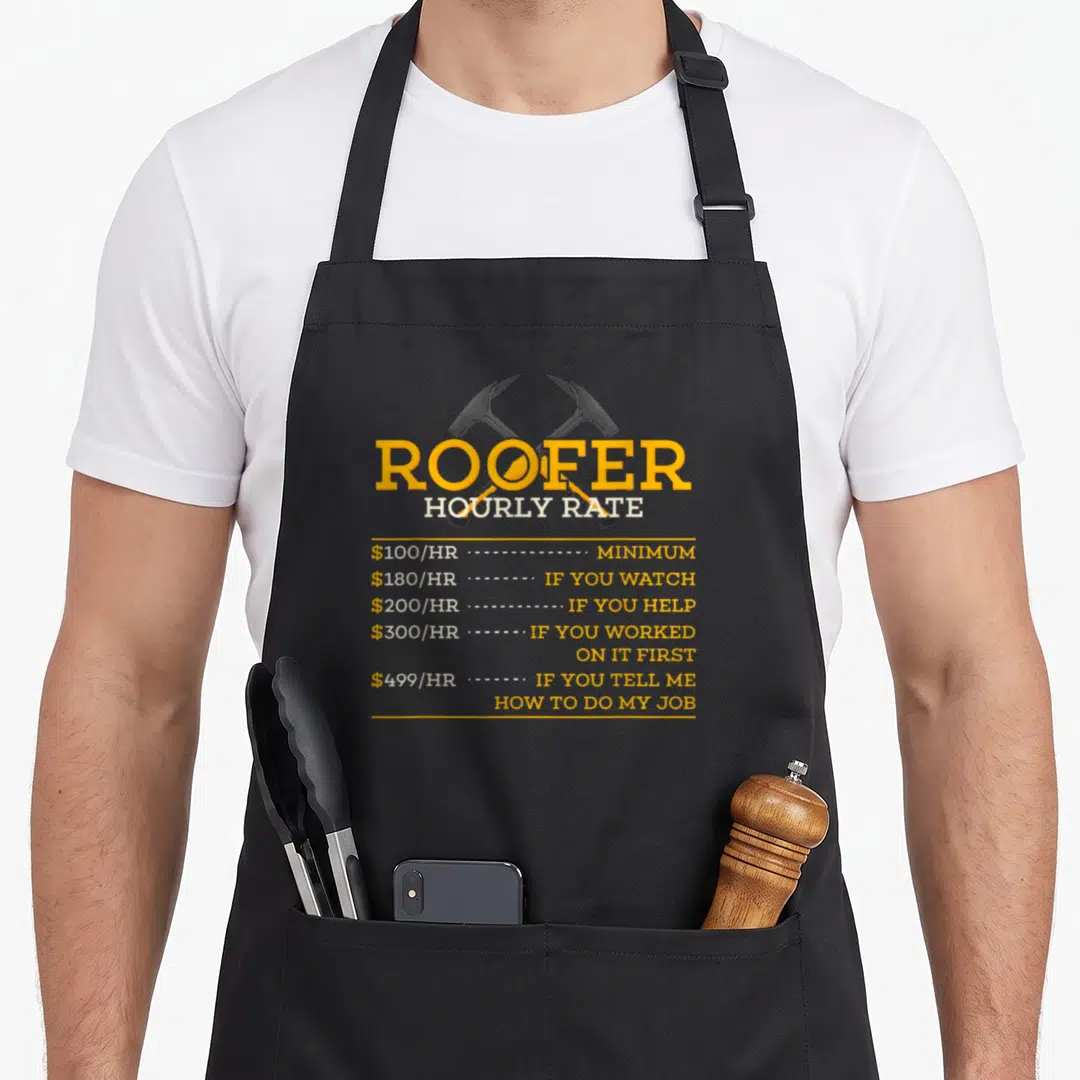 Hourly roofer apron - Crossed roofing hammers above hourly rate list with sarcasm text in yellow and white — shown on a black cotton canvas apron against a white background