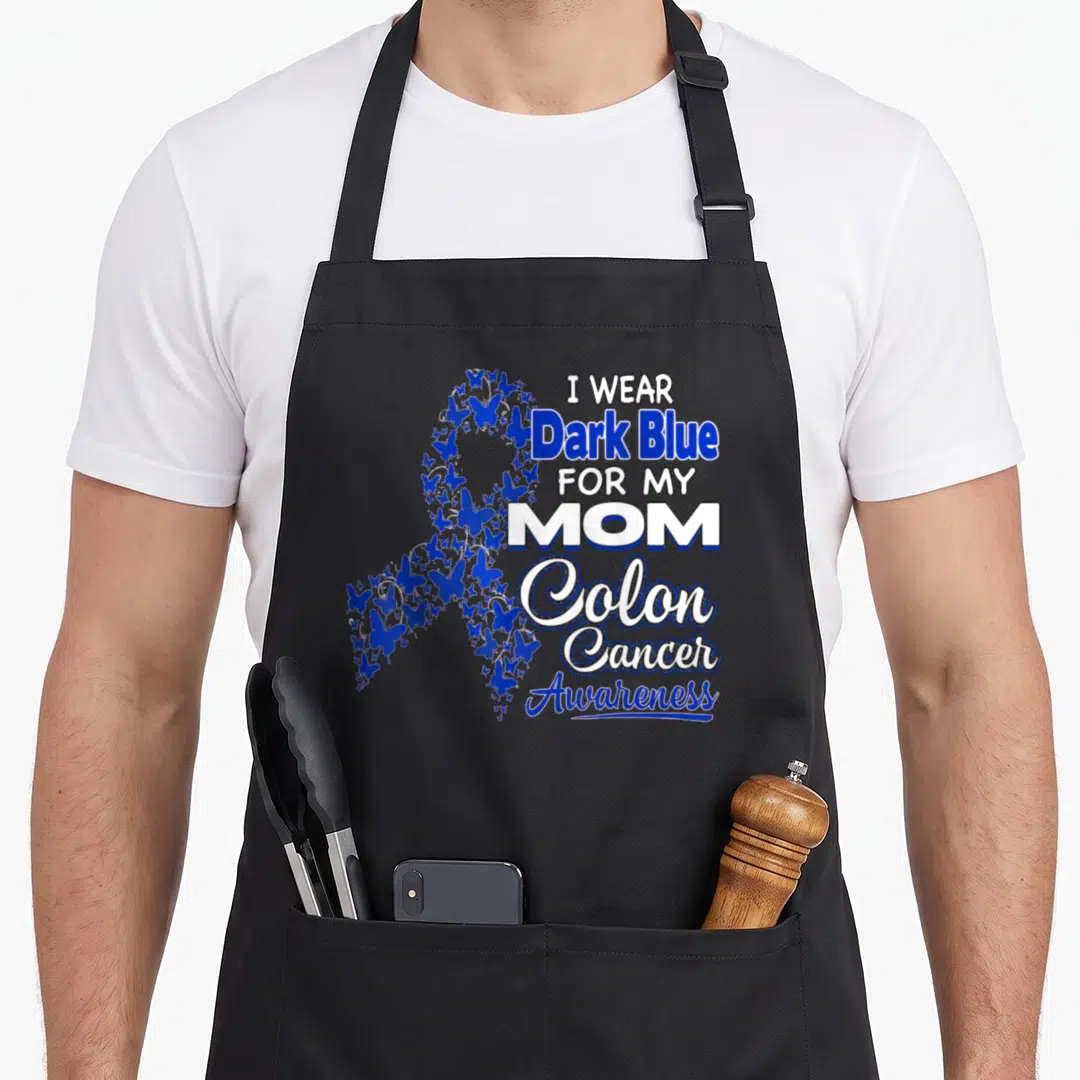 Dark cancer girl apron - Butterfly awareness ribbon with I Wear Dark Blue For My Mom Colon Cancer Awareness text — shown on a black cotton canvas apron against a white background