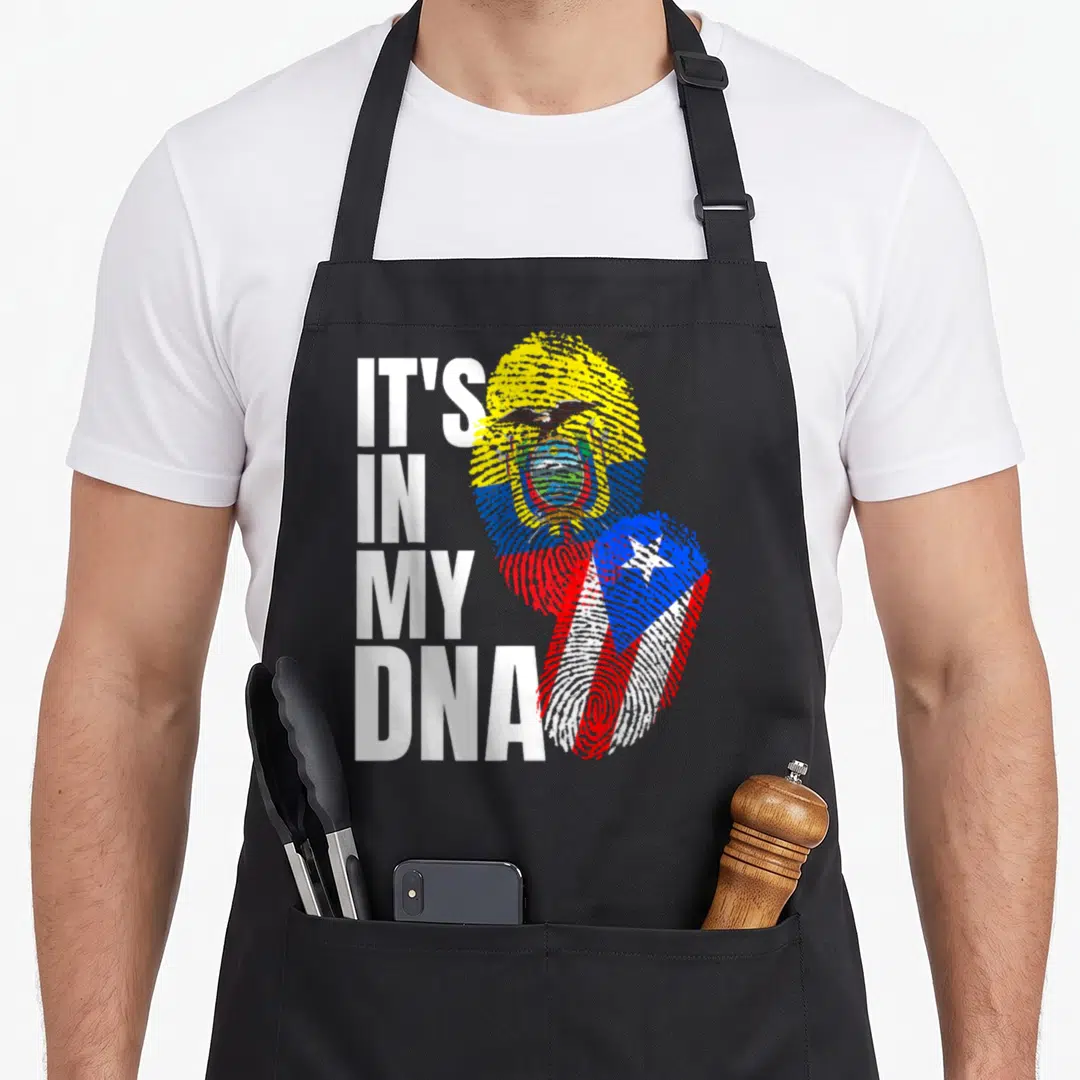 Dna heritage aprons - IT'S IN MY DNA text beside fingerprints filled with Ecuador and Puerto Rico flags — shown on a black cotton canvas apron against a white background