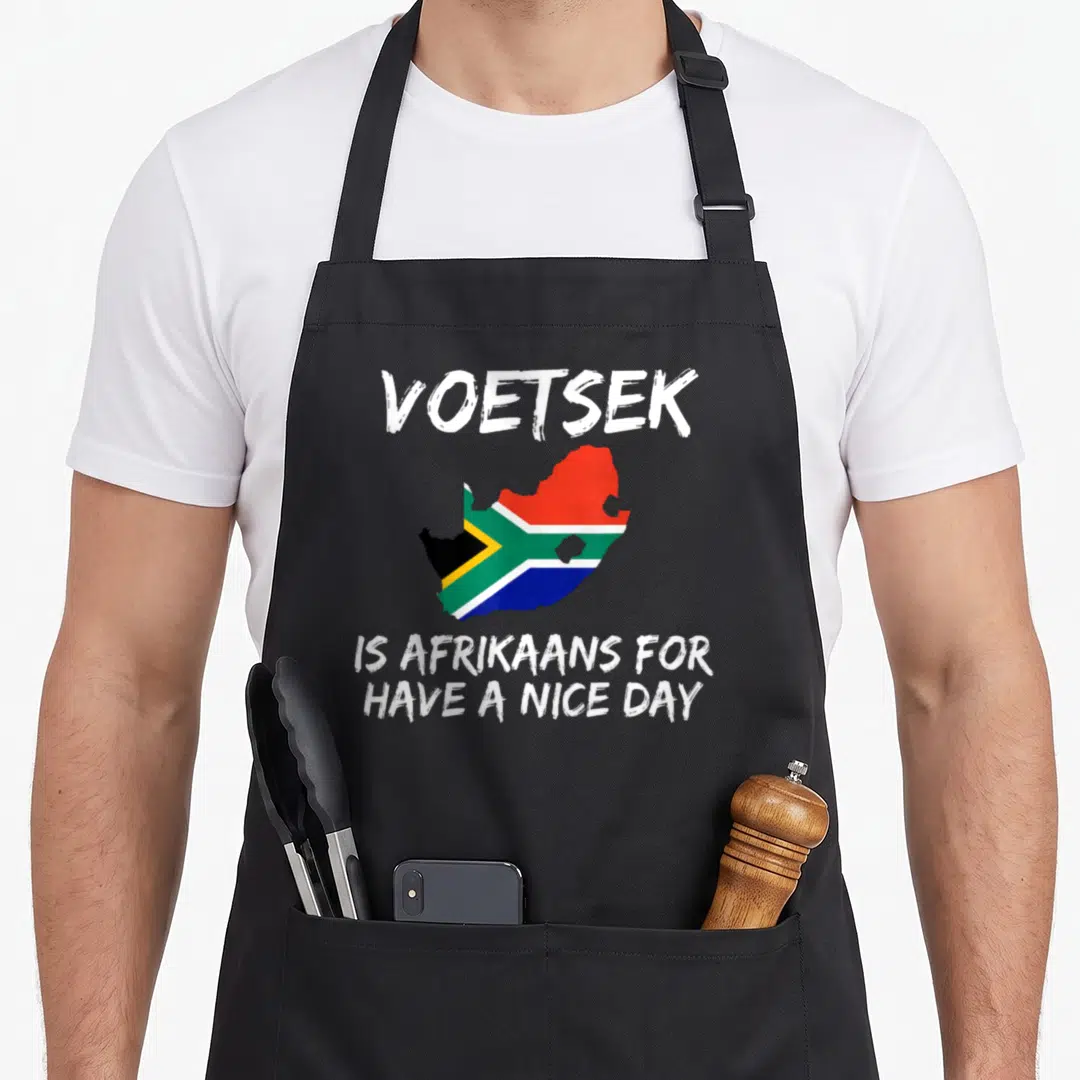 Voetsek south african apron - VOETSEK text above a South Africa map filled with national flag colors and explanatory — shown on a black cotton canvas apron against a white background