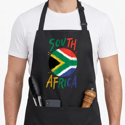 Africa flag south african apron - Retro circular South African flag in red green blue and yellow with arched text — shown on a black cotton canvas apron against a white background
