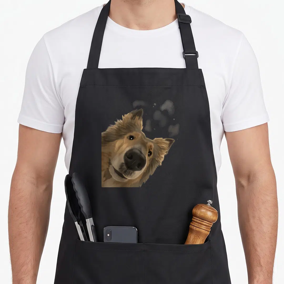 Curious dog apron - Brown and grey watercolor rough collie head with grey splatters — shown on a black cotton canvas apron against a white background