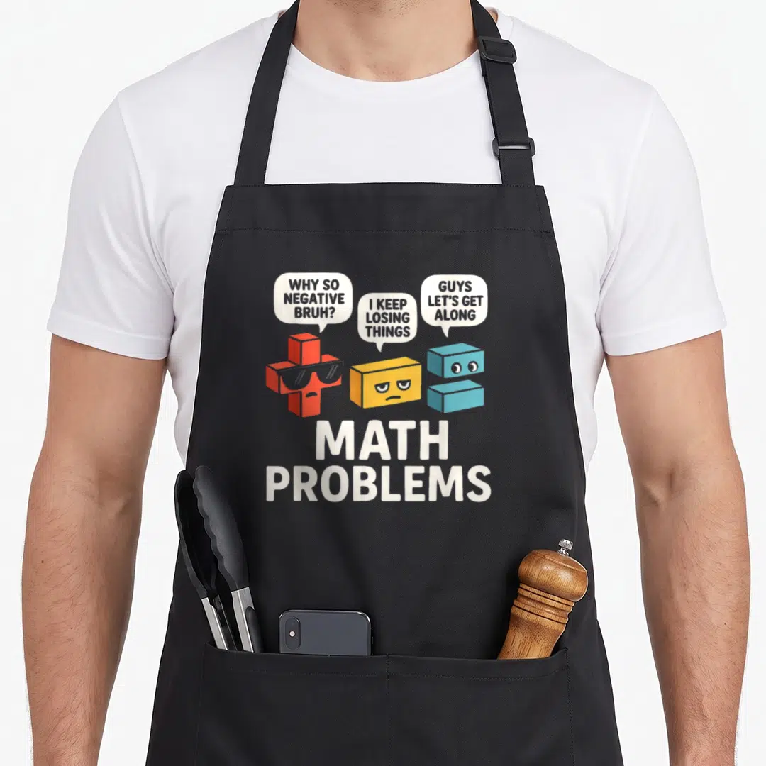 Math problem teacher apron - Three cartoon math symbols with speech bubbles and MATH PROBLEMS text — shown on a black cotton canvas apron against a white background