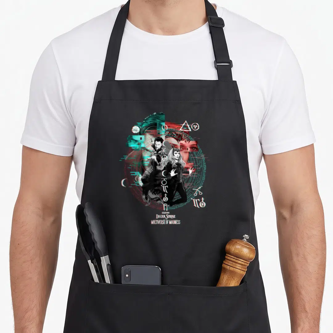 Glitch doctor apron - Doctor Strange and Wanda inside cyan magic circle with stacked white movie title text — shown on a black cotton canvas apron against a white background