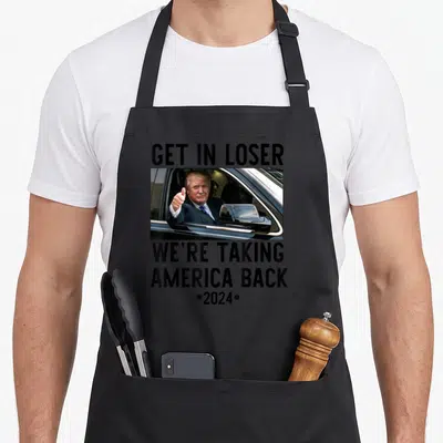 Trump get loser apron - Donald Trump thumbs up in car with GET IN LOSER WE'RE TAKING AMERICA BACK 2024 text — shown on a black cotton canvas apron against a white background