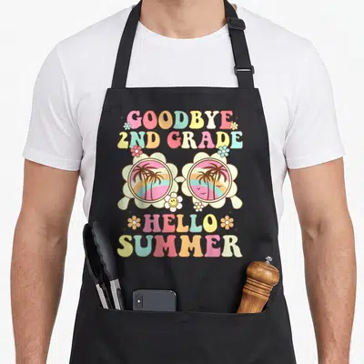 Hello summer 2nd apron - Retro flower sunglasses with sunset scenes and goodbye 2nd grade hello summer text in pastel — shown on a black cotton canvas apron against a white background