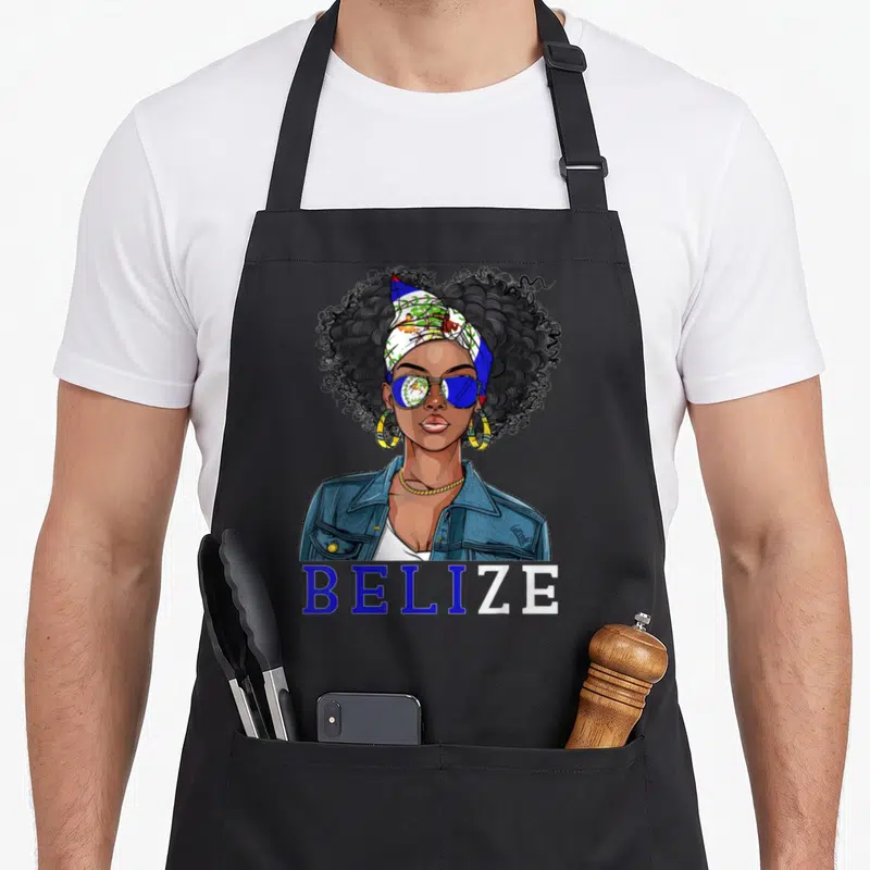 Belizean uniform apron - Cartoon woman with sunglasses above split blue and white BELIZE text — shown on a black cotton canvas apron against a white background