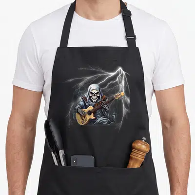 Ghost guitar skeleton apron - Hooded skeleton playing electric guitar with lightning bolts in cartoon art style — shown on a black cotton canvas apron against a white background