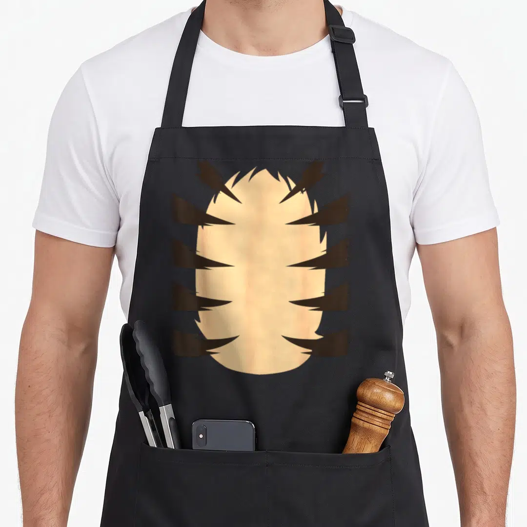 Tiger easy apron - Beige furry oval overlapped by five pairs of dark brown cartoon claw marks — shown on a black cotton canvas apron against a white background